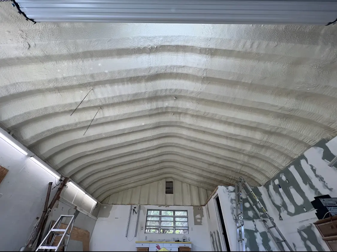 Spray polyurethane foam applied to the underside of a metal roof deck in Lakeside